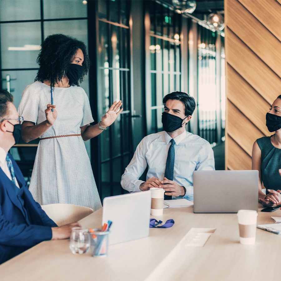 Four people discussing in the office